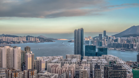 Soft sunset glow highlights dense Hung Hom buildings Feb 1 2026