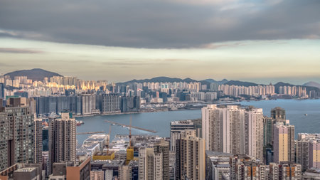 Soft sunset glow highlights dense Hung Hom buildings Feb 1 2026