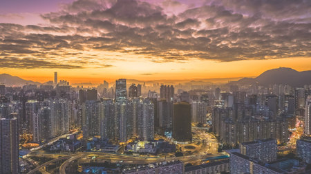 Evening glow highlights towering city buildings across Kowloon Feb 5 2026のeditorial素材