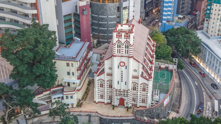 Traditional ecclesiastical architecture contrasts against surrounding modern building Feb 14 2026のeditorial素材