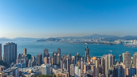 Sunlit high rise towers rise above bright harbour panorama Feb 14 2026のeditorial素材