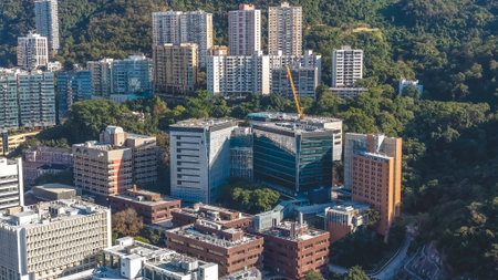 Prestigious university buildings sit atop lush hillside overlooking city Feb 14 2026のeditorial素材