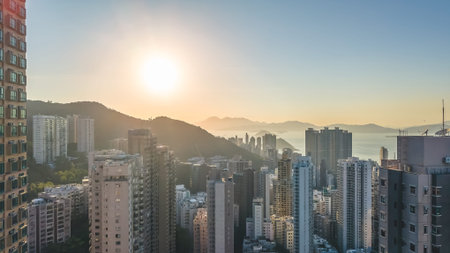 Sunlit high rise towers rise above bright harbour panorama Feb 14 2026