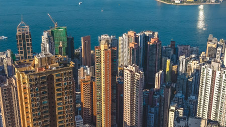 Sunlit high rise towers rise above bright harbour panorama Feb 14 2026