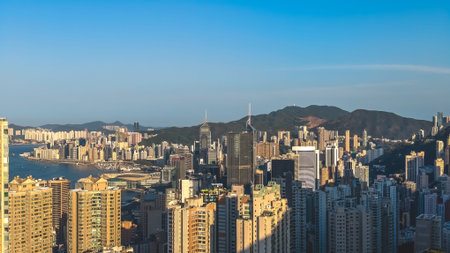 Sunlit high rise towers rise above bright harbour panorama Feb 14 2026のeditorial素材