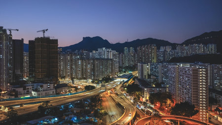 Elevated highway system channels traffic beside colorful housing estates Feb 15 2026のeditorial素材