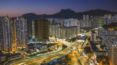 Elevated highway system channels traffic beside colorful housing estates Feb 15 2026のeditorial素材