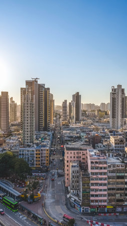 Curving highways lead toward dense towers and distant mountains Feb 15 2026のeditorial素材