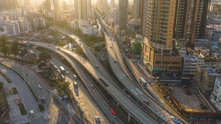 Curving roadway channels traffic through dense residential high rise district Feb 15 2026