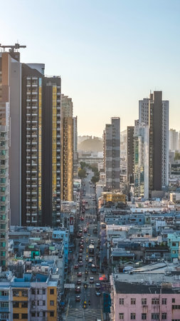 Busy roadway fills with taxis and pedestrians amid aging buildings Feb 15 2026のeditorial素材