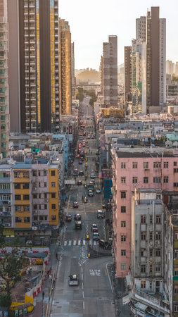 Busy roadway fills with taxis and pedestrians amid aging buildings Feb 15 2026