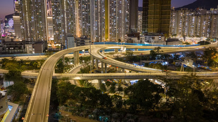Elevated highway system channels traffic beside colorful housing estates Feb 15 2026のeditorial素材