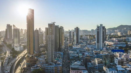 Curving highways lead toward dense towers and distant mountains Feb 15 2026のeditorial素材