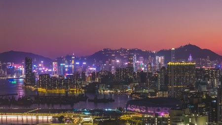 Modern residential towers overlook calm waters and bustling shoreline Feb 15 2026のeditorial素材