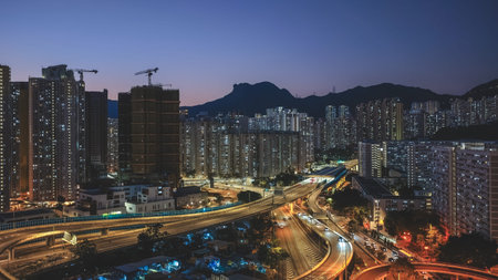 Elevated highway system channels traffic beside colorful housing estates Feb 15 2026のeditorial素材