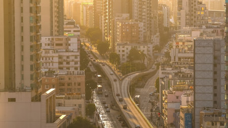 Curving roadway channels traffic through dense residential high rise district Feb 15 2026のeditorial素材
