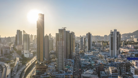 Curving highways lead toward dense towers and distant mountains Feb 15 2026のeditorial素材