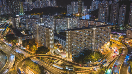 Elevated highway system channels traffic beside colorful housing estates Feb 15 2026のeditorial素材