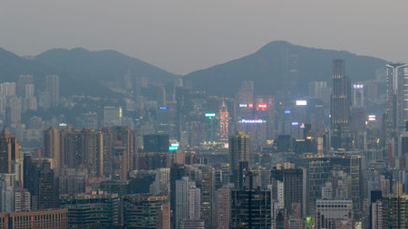 Layered residential towers stand before dense illuminated city backdrop Feb 13 2026のeditorial素材
