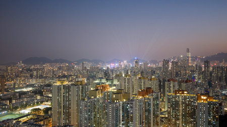 Layered residential towers stand before dense illuminated city backdrop Feb 13 2026のeditorial素材