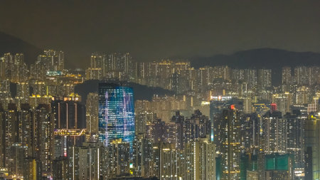 Glowing residential high rises create layered nighttime urban scenery Feb 13 2026のeditorial素材