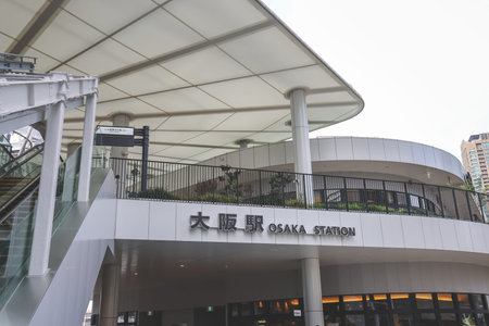 Modern station exit connecting commuters to green urban oasis Nov 25 2025