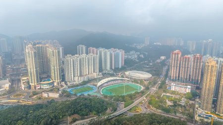 view shows stadium, greenery, and highrise estates in TKO Feb 21 2026のeditorial素材