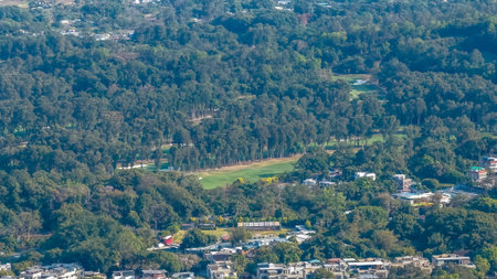 Lush green course landscape surrounded by trees and open space Feb 18 2026のeditorial素材