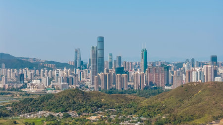 Contemporary urban skyline showcasing dense skyscrapers under clear daylight Feb 18 2026
