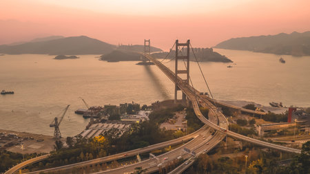 Sweeping coastal landmark featuring towers, cables, highways, and islands Feb 21 2026のeditorial素材