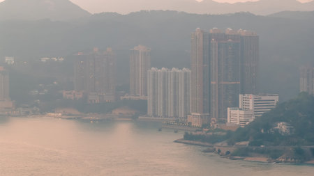 Scenic shoreline featuring vessels, highways, hillside housing Feb 21 2026のeditorial素材