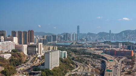 Major elevated highway curves beside cranes and distant mountains Feb 16 2026のeditorial素材