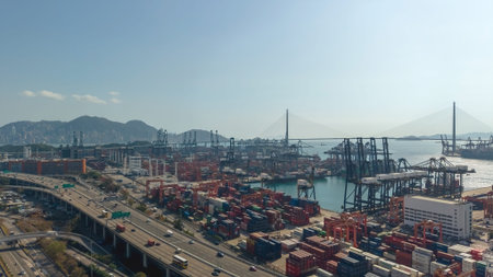 Expansive container port glows beneath warm hazy evening light Feb 16 2026