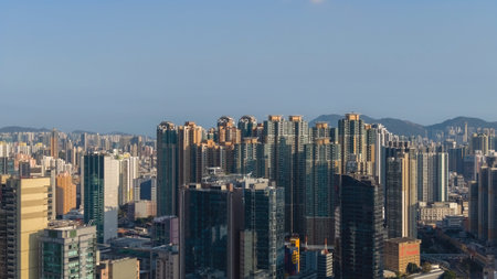 Modern commercial towers rise prominently above dense urban district Feb 16 2026
