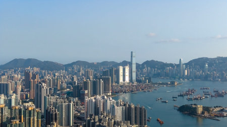 Urban highrise district overlooks harbour waters and distant peaks Feb 16 2026