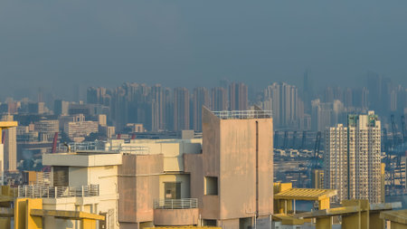 High rise district featuring port machinery, housing towers, and distant hills Feb 21 2026