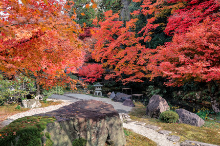 Raked sand and stones framed by vibrant seasonal foliage Nov 26 2025