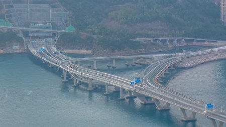 Sweeping aerial view reveals bridge, coastline, skyline, and mountains Feb 22 2026
