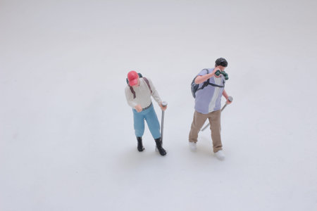 Small models posed together wearing backpacks and travel gear