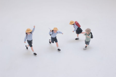 Miniature models show active movement with coordinated school attireの写真素材