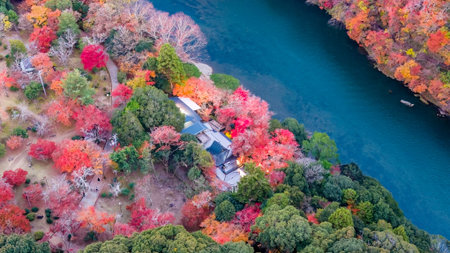 Steep rocky gorge with flowing river and autumn trees NOV 28 2025