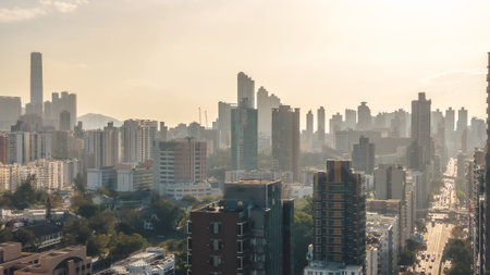 Major urban roadway lined with dense residential and commercial buildings March 14 2026