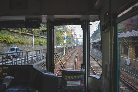 train cab shows tracks curving ahead through calm countryside Nov 27 2025のeditorial素材
