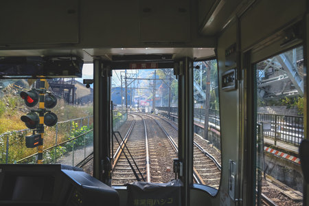 train cab shows tracks curving ahead through calm countryside Nov 27 2025