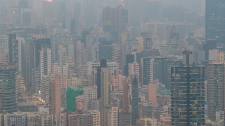 March 27 2026 Tall urban buildings recede into thick bluish atmospheric haze.