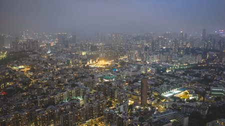March 27 2026 Urban neighborhoods shine brightly beneath soft atmospheric evening haze.