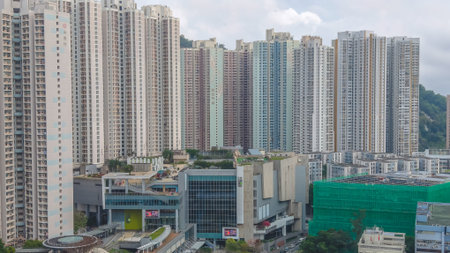 March 27 2026 Dense high rise buildings stand beside greenery