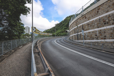 June 20 2026 Hong Kong Curving Mountain Road With Warning Signs