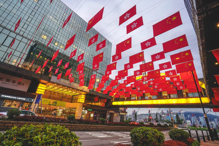 June 26 2026 Hong Kong. Patriotic flags waving against the Victoria Harbour