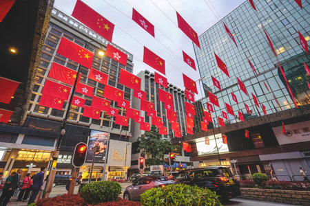 June 26 2026 Hong Kong. Patriotic flags waving against the Victoria Harbour